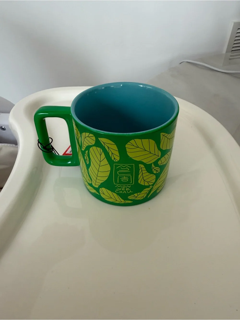 Starbucks Green and Teal Ceramic Mug with Leaf and Lion Motif